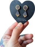 a comedy a tragedy: brass studs