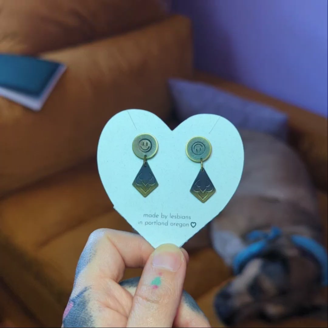 a tragedy a comedy: brass studs